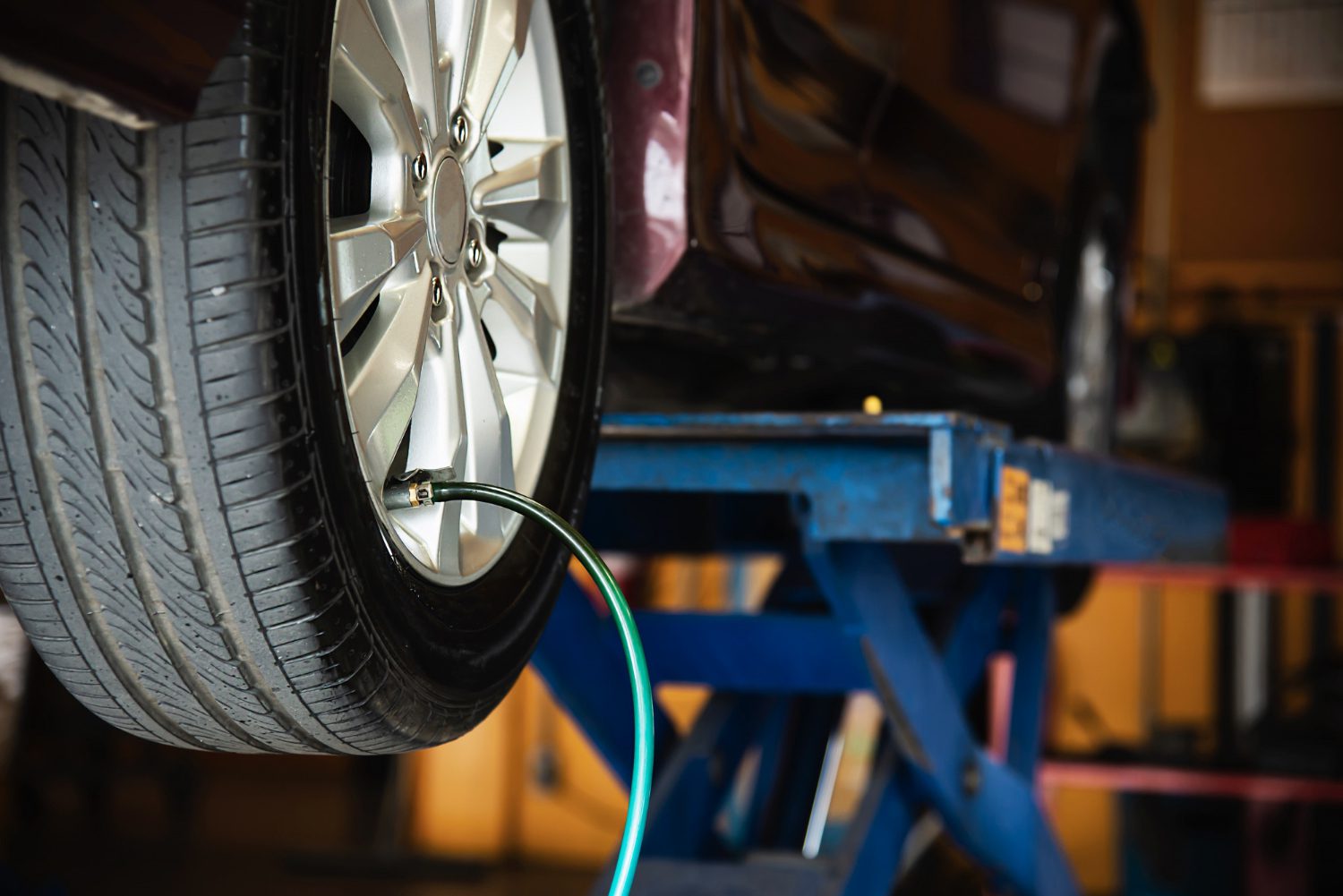 technician-is-inflate-car-tire-car-maintenance-service-transportation-safety